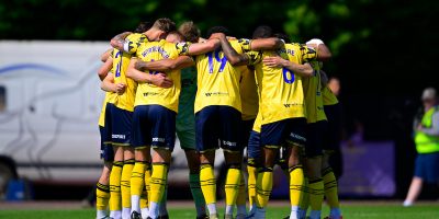Torquay United huddle during the National League South Playoff Final match between Hornchurch and Torquay United  at Hornchurch Stadium, Upminster on 9 May 2026 - PHOTO: Tom Sandberg/PPAUK