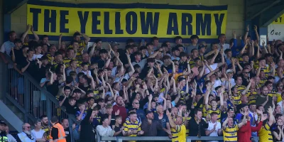 Torquay United supporters at a packed Plainmoor during the National League South Play-Off Semi-Final match between Torquay United and Boreham Wood at Plainmoor, Torquay on Saturday 3rd May 2025 - PHOTO: Frankie OKeeffe/PPAUK