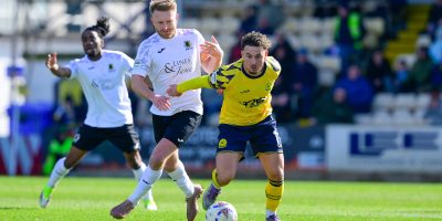 Dylan Morgan of Torquay United challenges for the ball with Freddie Hammond of Horsham during the National League South match between Torquay United and Horsham at Plainmoor, Torquay on Saturday 28th March 2026 - PHOTO: Frankie OKeeffe/PPAUK