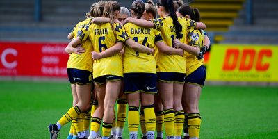 Torquay United Women team huddle during the Adobe Womens FA Cup match between Torquay United Women and Exeter City Women at Plainmoor, Torquay, 26th October 2025 - PHOTO: Phil Mingo/PPAUK