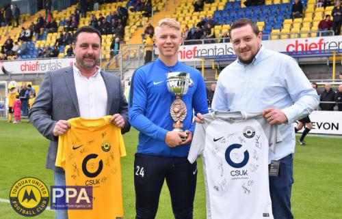 George Dowling is presented his Young Player of the Season Award by Neil Pardon & Kalern from shirt sponsor Custom Surfaces UK.